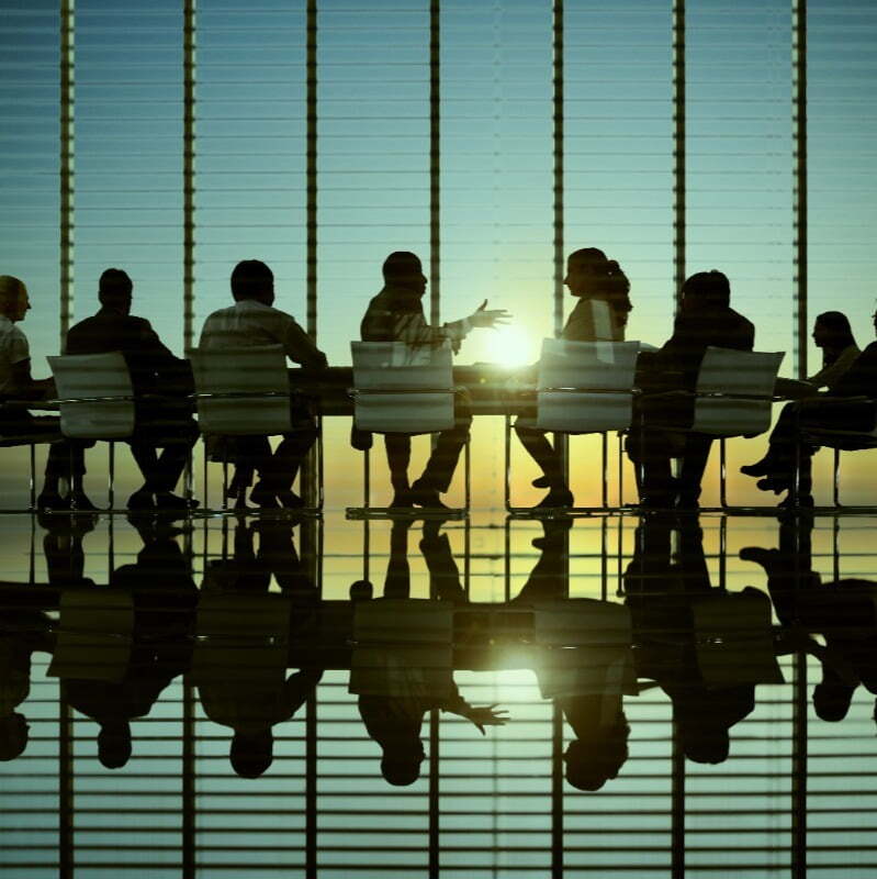 Staff around a boardroom table